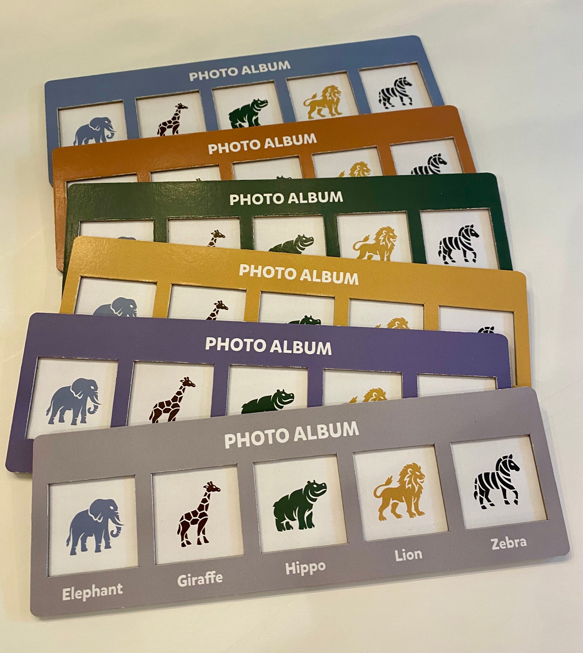 Set of photo albums with animal illustrations on a white background
