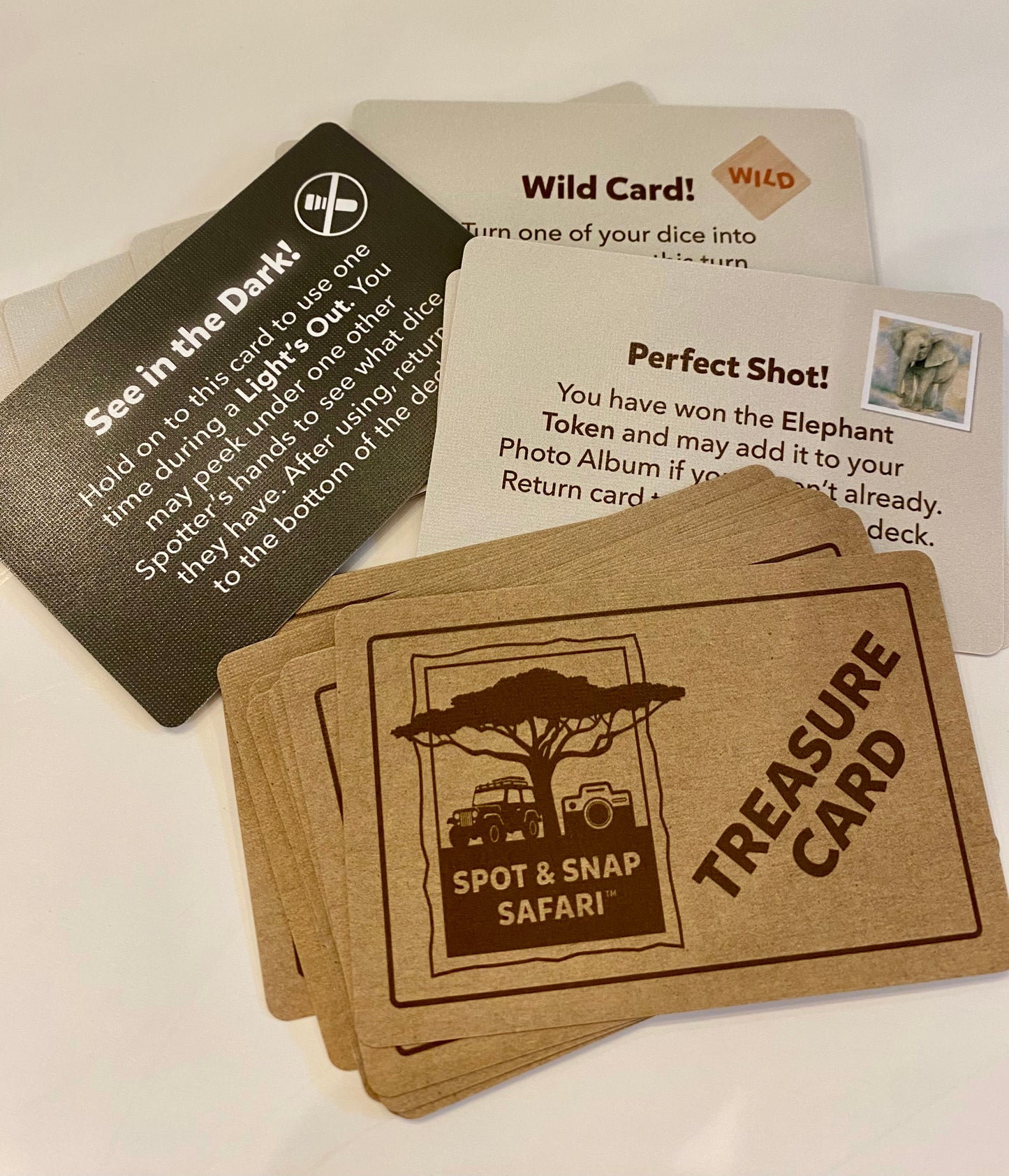 Collection of game cards with text and graphics on a white background